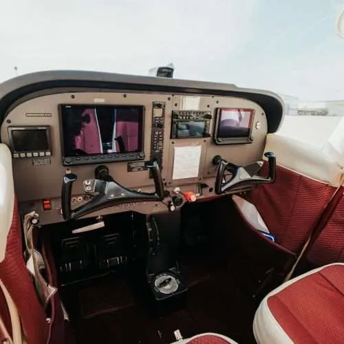 View of empty two seater cockpit.